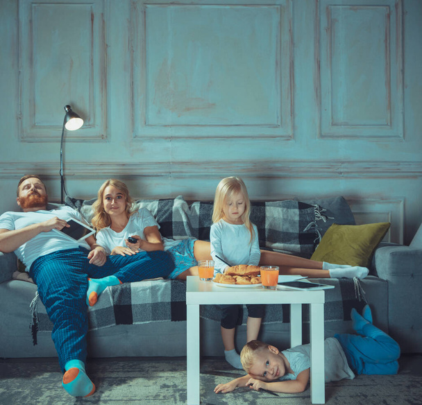 Mother, father and kids at home having fun, comfort and cozy concept - Fotografie, Obrázek