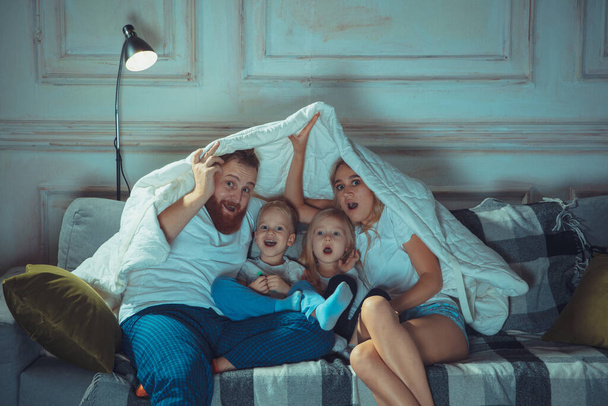 Mother, father and kids at home having fun, comfort and cozy concept - Φωτογραφία, εικόνα