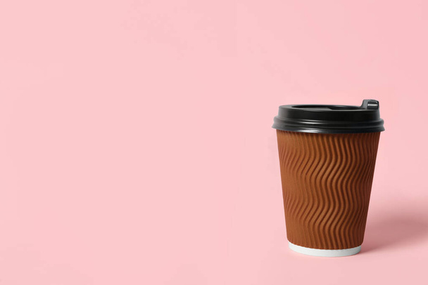 Takeaway paper coffee cup on pink background. Space for text - Photo, image