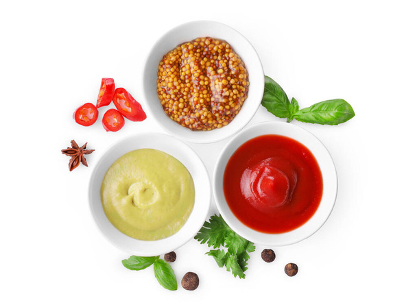 Various sauces in small bowls isolated on white background. Top view. - Photo, Image