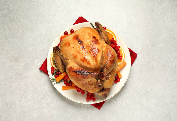 Delicious cooked turkey served on light table, flat lay. Thanksgiving Day celebration - Valokuva, kuva