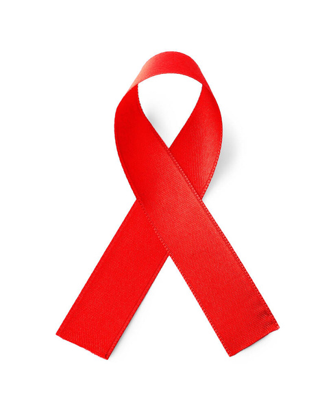 Red ribbon isolated on white, top view. AIDS disease awareness - Foto, Imagem