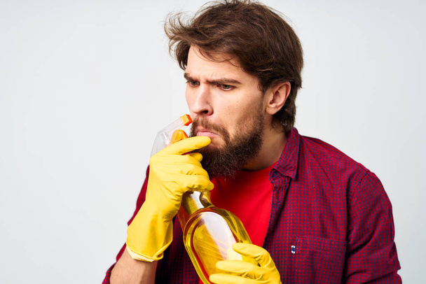emotional man wearing rubber gloves detergent homework lifestyle professional - Fotoğraf, Görsel