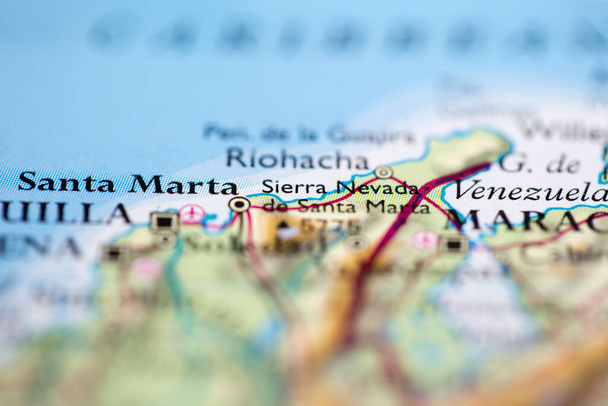 Shallow depth of field focus on geographical map location of Mount Sierra Nevada de Santa Marta in Colombia South America continent on atlas - Photo, Image