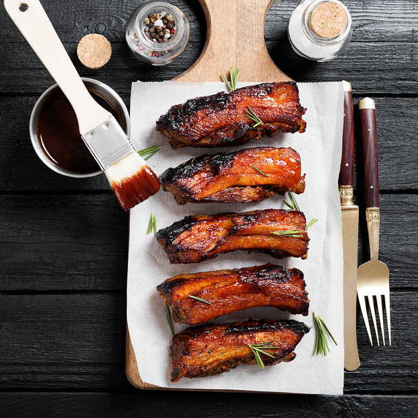 Pork ribs grilled with bbq sauce and caramelized in honey. - Photo, image