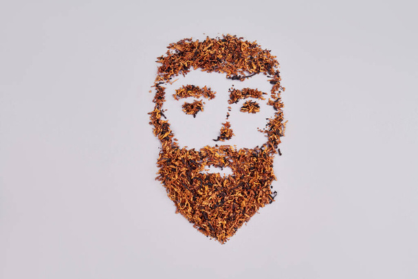 Cara de hombre hecha de hojas de té. - Foto, imagen