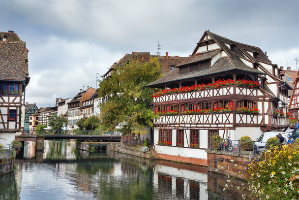 View of embankment of the Ill river in  Petite France district with Maison des Tanneurs (tanners house), Strasbourg, France - Photo, Image