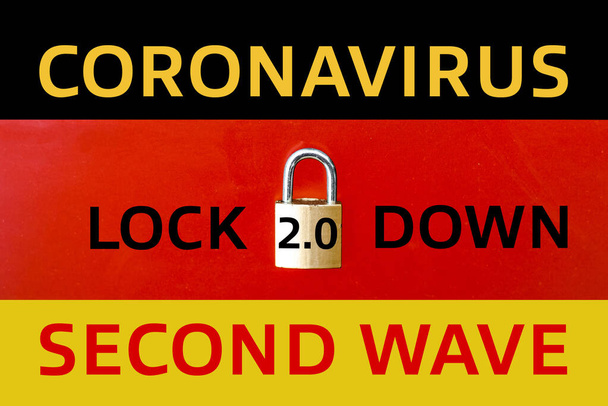 ドイツで2番目のロックダウンの概念。ドイツの旗の上に置かれた本当の南京錠は、 COVID-19ケースの上昇のために国の2番目の国家のロックダウンを示すために. - 写真・画像