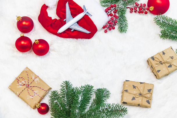 Travel for Christmas. Airplane with Christmas decor. Selective focus.Holiday - Photo, Image