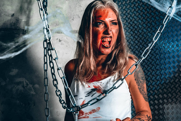 Halloween photo session in the studio. Bloody woman. Cool - Photo, Image