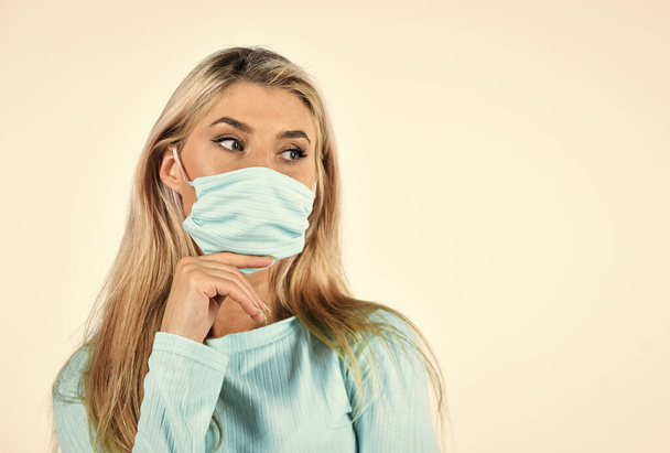 blonde female wear medical mask on face. fit woman wear protective mask. coronavirus health protection. girl in respirator mask isolated on white. doing sport while quarantine. copy space - Foto, Imagen