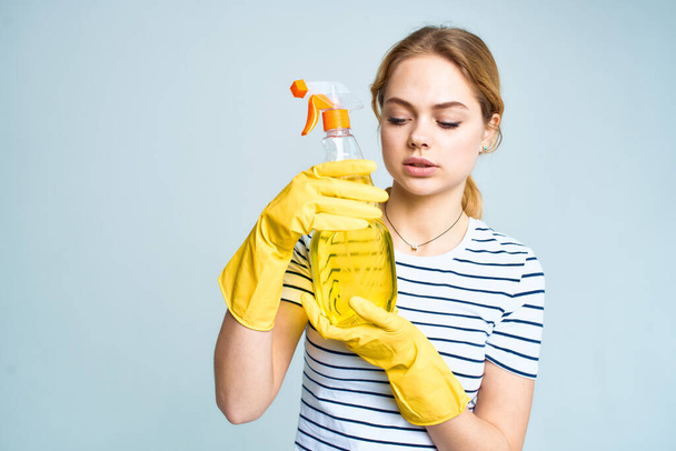 Woman with detergent cleaning housework lifestyle service light background - Φωτογραφία, εικόνα