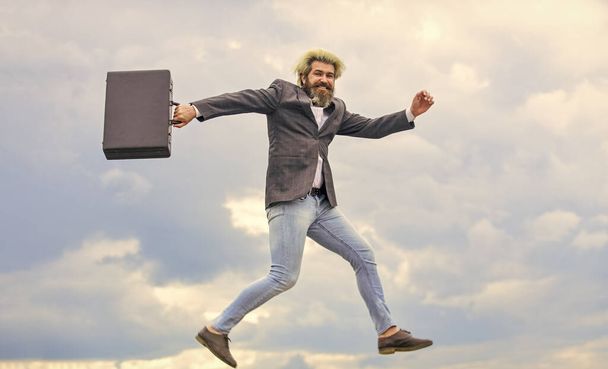 Businessman run away business case. Happy worker. Freedom. Feeling free. Energetic entrepreneur. Business man formal suit carries briefcase. Illegal deal business. Feel impact. Hipster hold briefcase - Photo, image