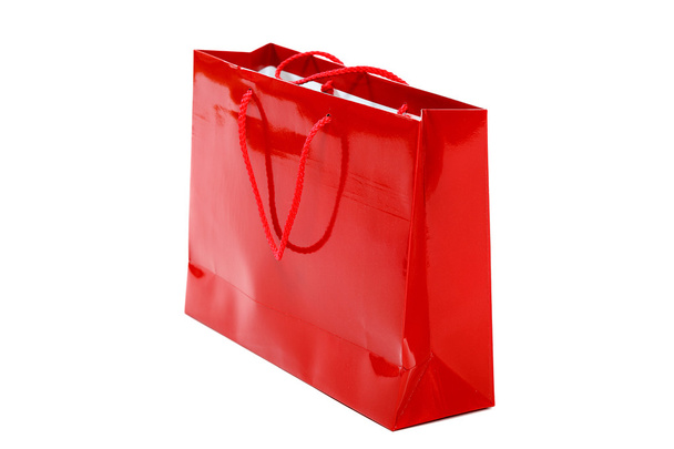 Red gift bag on a white background. - Photo, image
