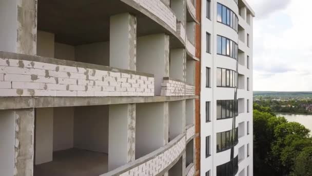 Rooms interior of new apartment building facade under construction. - Footage, Video