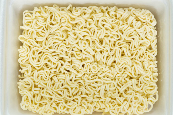 instant noodles in rectangle plastic plate, top view - Photo, Image