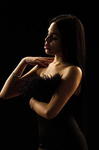 Seductive lady. Beautiful decollete. Fashion concept. Fancy clothes. Fashion shop. Emphasize sexuality. Sexual hint. Attractive woman fashion model. Fashionable girl wearing dress with feathers - Foto, Imagen