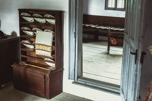 Sibiu, Romania - June 27, 2020. Traditional Romanian folk house interior with rural furniture and decoration. Astra Museum of Traditional Folk Civilization, Sibiu - Φωτογραφία, εικόνα