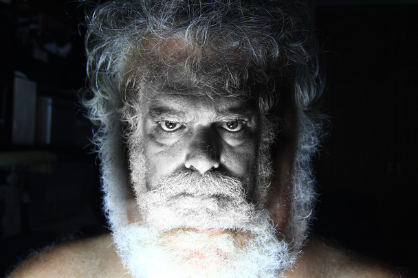 Mature bearded man with angry face staring - Foto, afbeelding