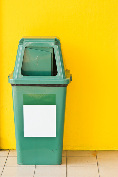 Green Plastic Waste Container with yellow backgrond - Foto, immagini
