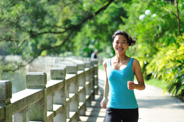 Asian woman jogging at park - Photo, Image