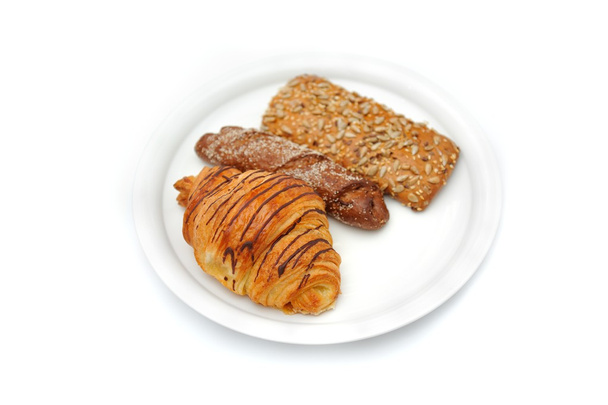 Breakfast bread on white plate on white background - Photo, Image