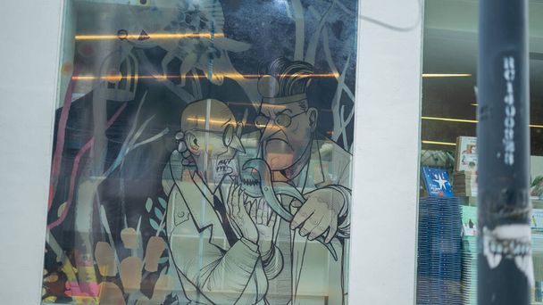 Γελοιογραφία εικόνα ενός οδοντίατρου και του ασθενούς του ζωγραφισμένα σε ένα παράθυρο - Φωτογραφία, εικόνα