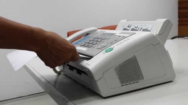 hand man are using a fax machine in the office, equipment for data transmission. - Footage, Video