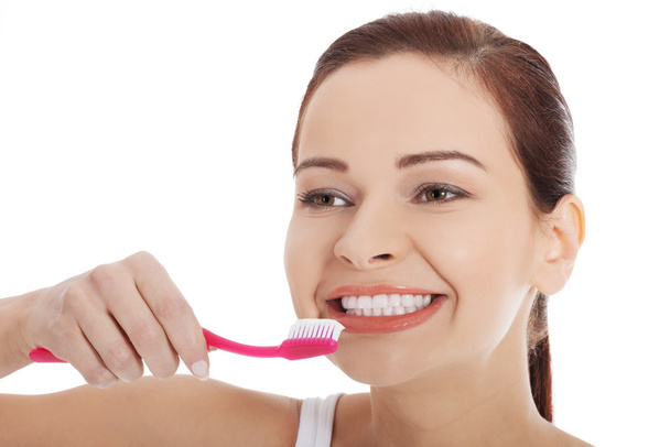 Woman holding tooth brush - Foto, Imagen