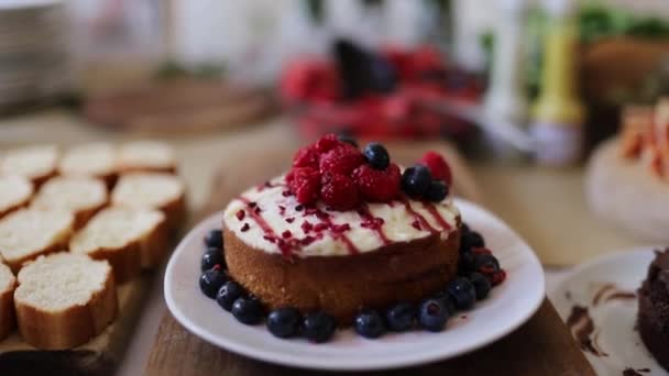 Berries and Chocolate Cakes with More Baked Goods on a Table - Footage, Video