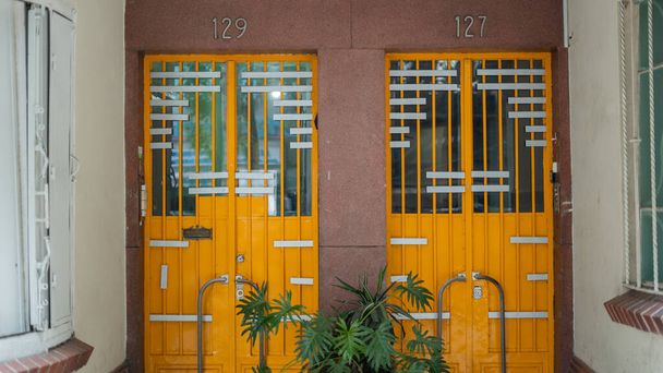 Number 129 and 127 From an Apartment Building in Colorful Mexico City - Foto, Imagen