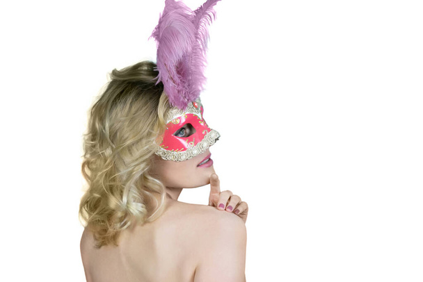 Red carnival mask with feathers on a white background, isolate. - Foto, imagen