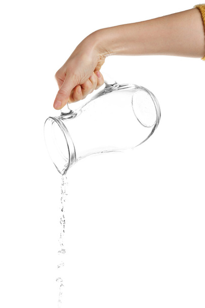 Pouring water from glass pitcher, isolated on white - Foto, afbeelding