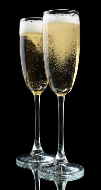 Glasses of champagne, on black background - Foto, Bild