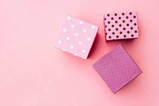 Gift boxs on paste pink background. - Fotó, kép