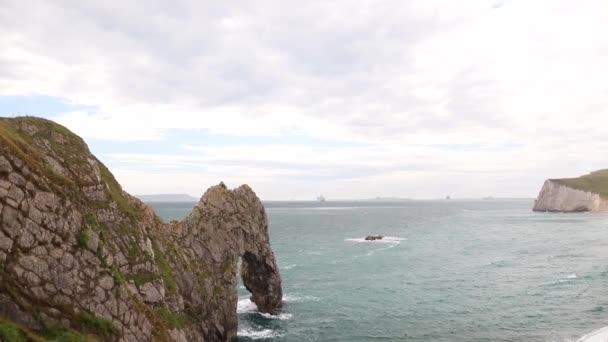 Astonishing View of The Durdle Door on a Cloudy and Windy Day - Filmati, video