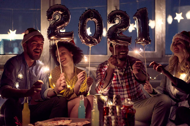 Excited couples at New Year eve home party in festive atmosphere. New Year, home party, friends time together - Foto, imagen