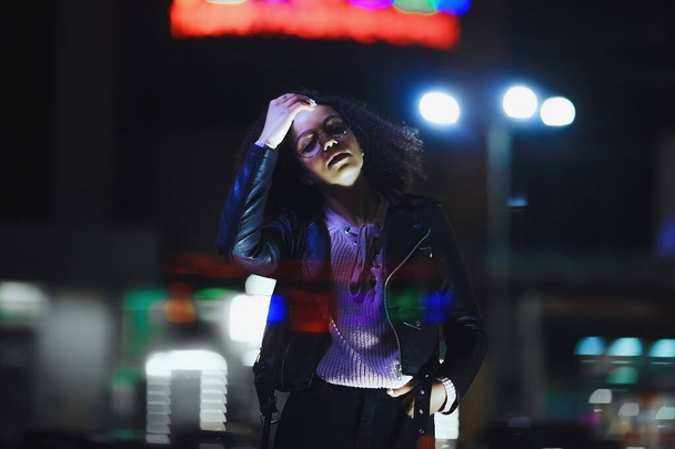Black  girl portrait in night city lights. Stylish African girl for lifestyle design - Foto, Imagen