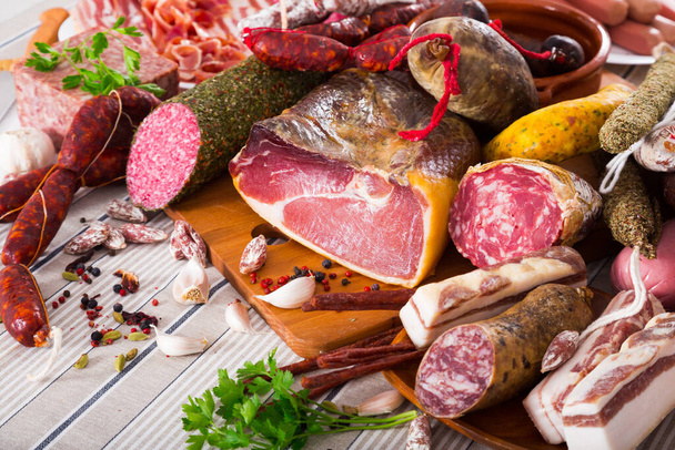 Variety of meats on table - Фото, зображення