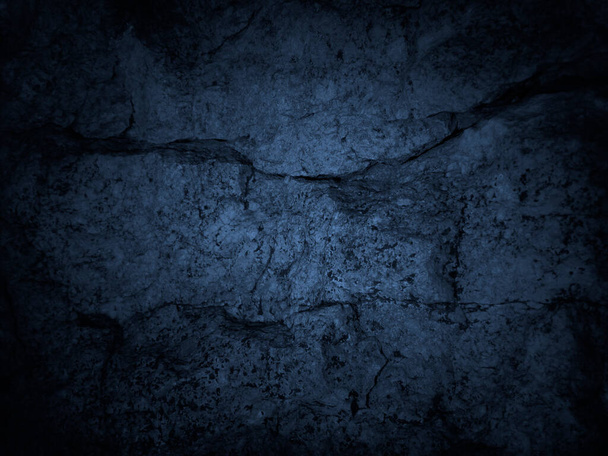     Black blue rough background. Toned rock texture with cracks. Macro. Dark blue grunge background. Old stone wall.                            - Photo, Image