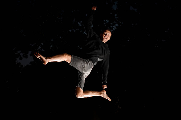 Man having fun and jump high in the air - Фото, изображение
