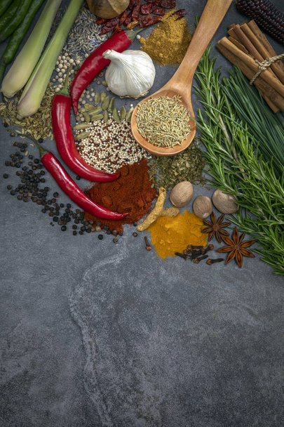 Herbs and Spices on a grey slate background with space for text. - Φωτογραφία, εικόνα