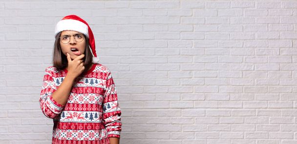pretty woman with santa hat. christmas concept - Photo, Image