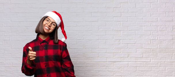 pretty woman with santa hat. christmas concept - Фото, зображення