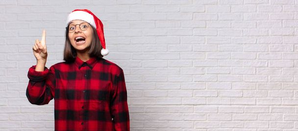 pretty woman with santa hat. christmas concept - Photo, Image