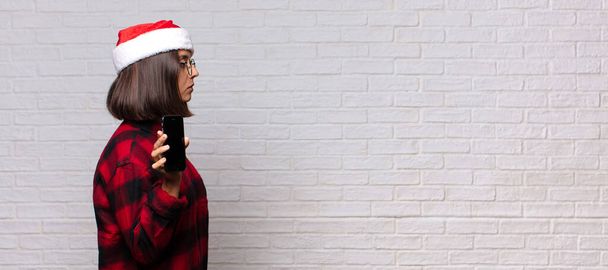 pretty woman with santa hat. christmas concept - Foto, Bild