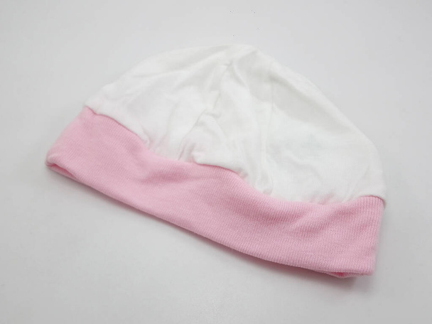 Рожево-біла головка капелюха для дитини
 - Фото, зображення