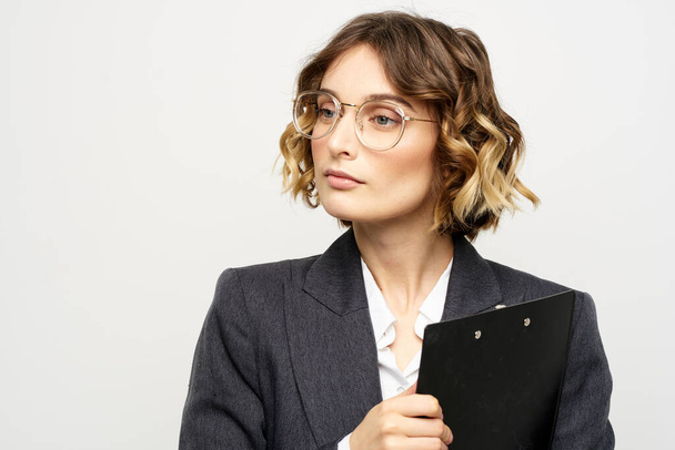 Woman in business suit finances work documents glasses hairstyle - Foto, Imagem