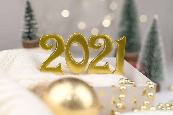 Numbers 2021 on Golden bokeh background New year mood, Christmas, greeting card, new year background. - Фото, зображення