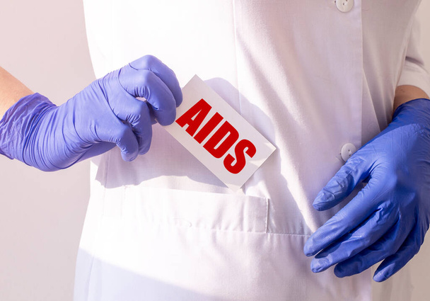AIDS acronym inscription, disease. word on white paper. - Fotografie, Obrázek
